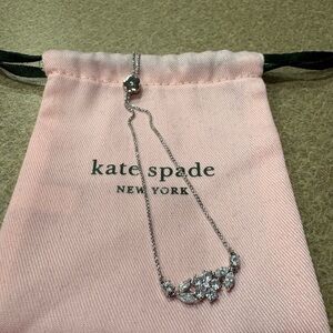 Kate Spade Silver Gleaming Gardenia Flower Slider Bracelet with pink pouch